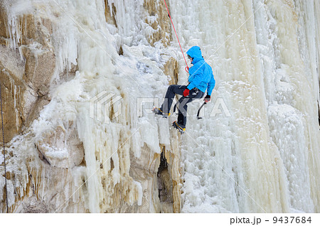 Young man climbing the ice 9437684