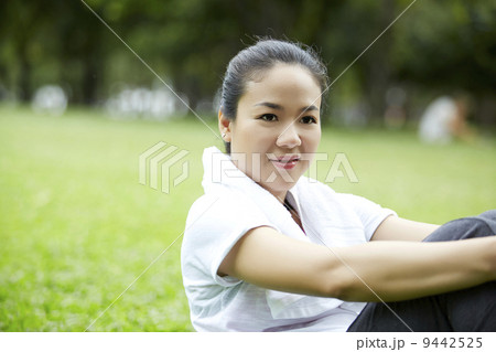 Asian Woman Resting After Exercising In Park 9442525
