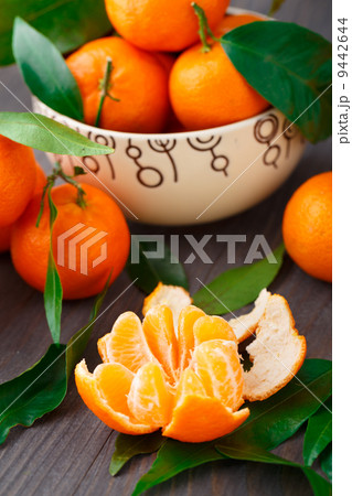 Tangerines on wooden background 9442644