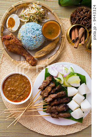 Nasi kerabu or nasi ulam, popular Malay rice dish. Blue color of 9443324
