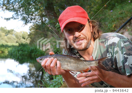 Fisherman and fish 9443642