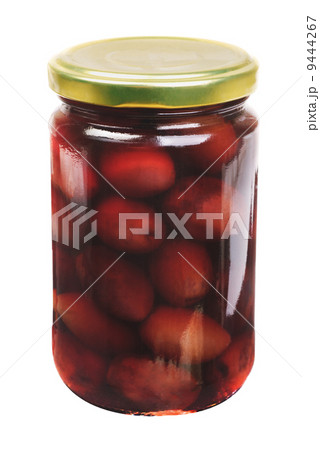 Glass jar with purple  olives kalamata  isolated on the white background Glass jar with purple  olives kalamata  isolated on the white background 9444267