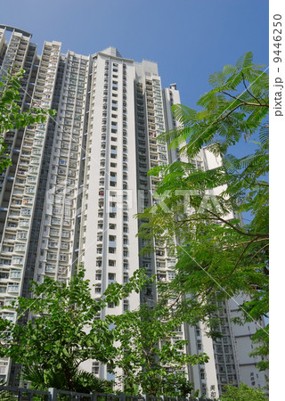 Tall white apartment exterior in the street 9446250