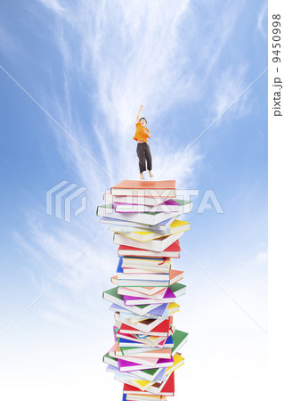 happy kid jumping on the books happy kid jumping on the books 9450998