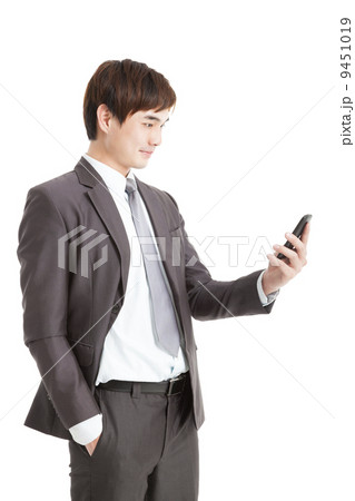 asian smart businessman holding smart phone 9451019