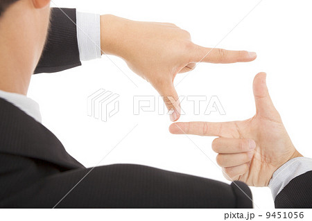 businessman making frame with hands 9451056