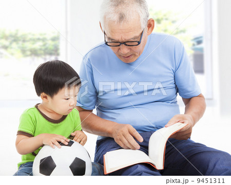 grandfather reading a story book for his grandson grandfather reading a story book for his grandson 9451311