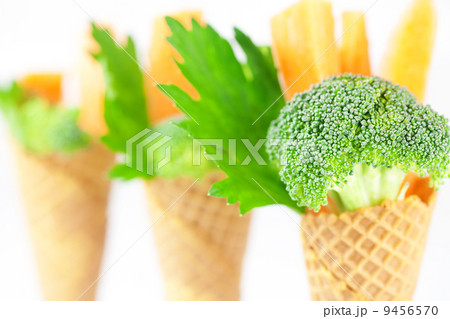 carrot, celery, broccoli in a waffle cone isolated on white carrot, celery, broccoli in a waffle cone isolated on white 9456570