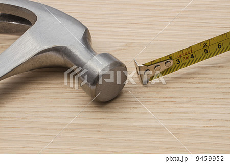 Old hammer and tape measure 9459952
