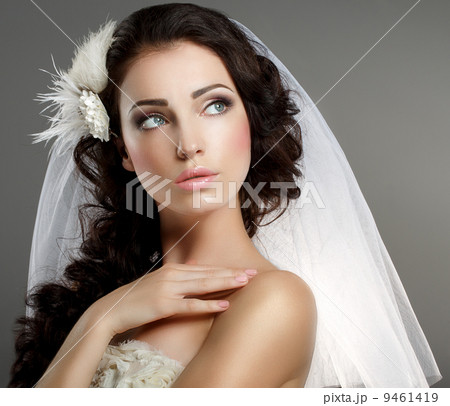 Wedding. Young Gentle Quiet Bride in Classic White Veil Looking Away 9461419