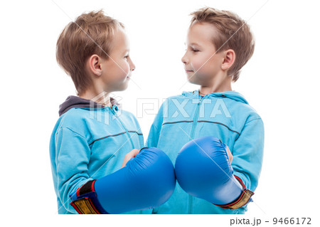 Cute twin boys posing looking at each other Cute twin boys posing looking at each other 9466172