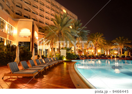 The swimming pool at luxury hotel in night illumination, Ajman, 9466445