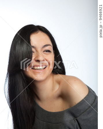 Portrait of attractive young smiling woman on white Portrait of attractive young smiling woman on white 9466921