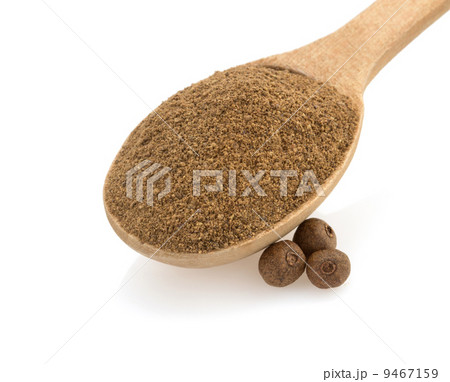allspice in spoon on white 9467159