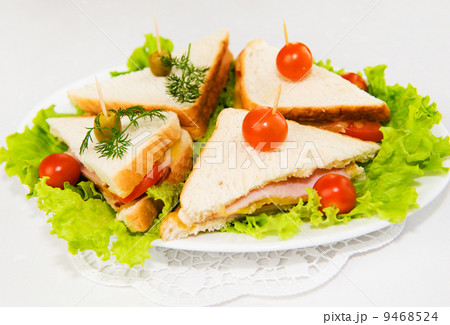 Eating on the run. Fresh and tasty home-made canape sandwiches 9468524