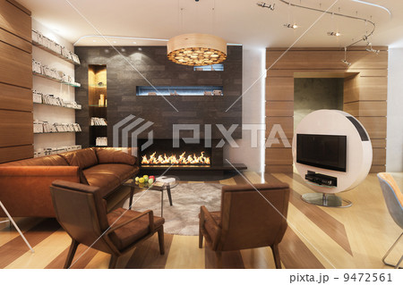 Living Room With Leather Sofa And Armchair Near The Fireplace 9472561