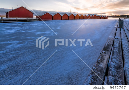 Boathouses and a frozen lake Boathouses and a frozen lake 9472767