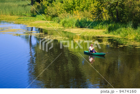 Man Fishing Out Of A Row Boat Man Fishing Out Of A Row Boat 9474160
