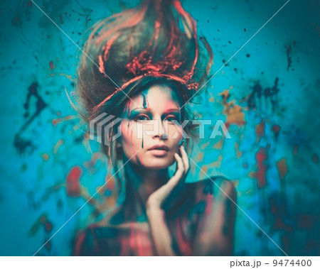 Young woman muse with creative body art and hairdo 9474400