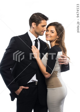 Beautiful young couple in suit and dress isolated on white background 9474533