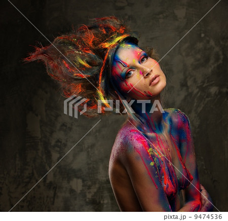 Young woman muse with creative body art and hairdo 9474536
