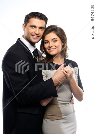 Beautiful young couple in suit and dress isolated on white background Beautiful young couple in suit and dress isolated on white background 9474539