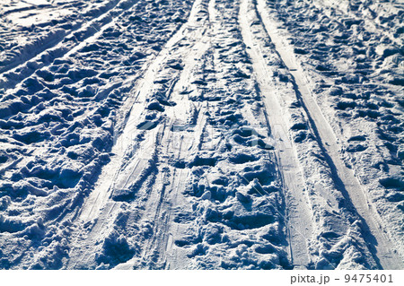 ski trails in snowy field in winter evening ski trails in snowy field in winter evening 9475401