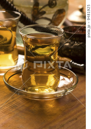 Cup of turkish tea and hookah served in traditional style Cup of turkish tea and hookah served in traditional style 9481925