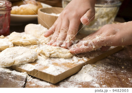 Detail of hands kneading dough 9482003