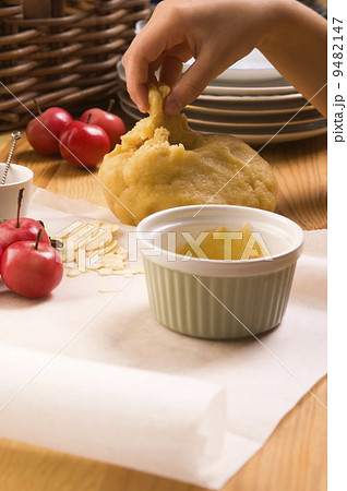 Detail of child hands making apple pie Detail of child hands making apple pie 9482147