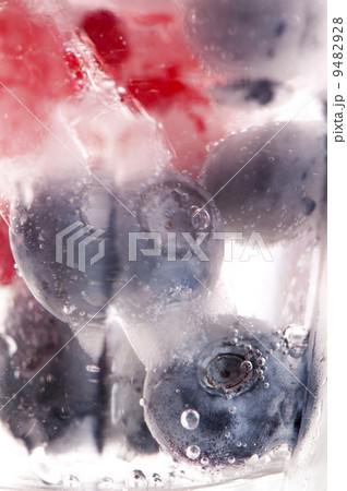 Raspberry and blackberry frozen in ice sticks 9482928