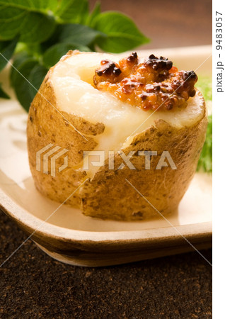 Baked potato with sour cream, grain Dijon mustard and herbs Baked potato with sour cream, grain Dijon mustard and herbs 9483057