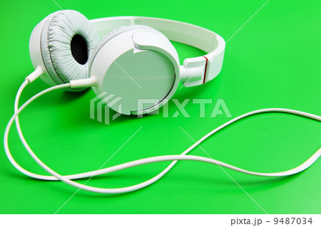 Headphone on green background 9487034