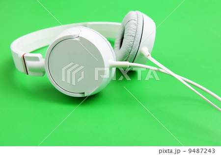 Headphone over green background 9487243
