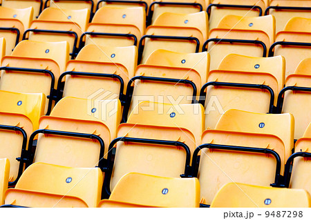 yellow plastic seats at stadium yellow plastic seats at stadium 9487298