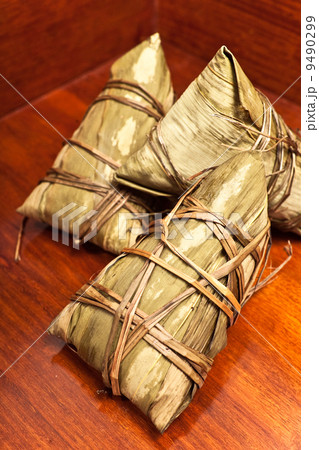 Rice dumplings on wooden background Rice dumplings on wooden background 9490299