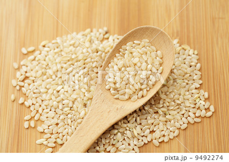 Uncooked rice on spoon 9492274
