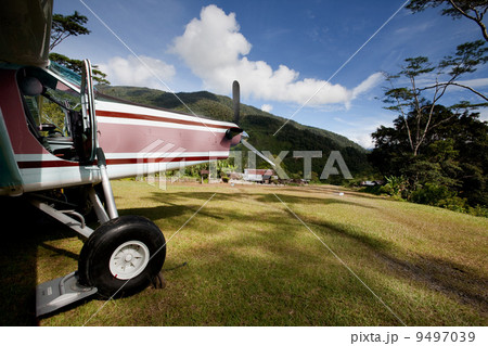 Airplane on Mountain Runway 9497039