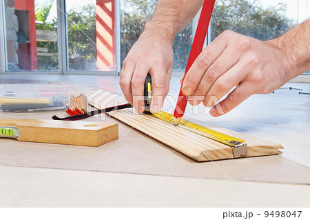 Engineer marking on plywood Engineer marking on plywood 9498047