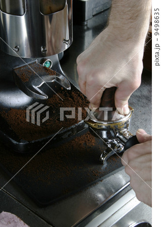 Tamping Espresso Grounds 9498635