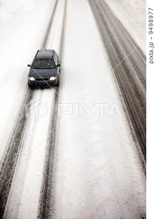 Car in Snow Storm 9498977