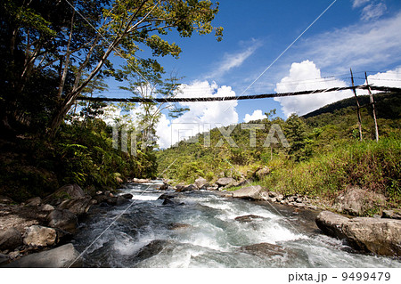 Mountain River with Hanging Bridge 9499479