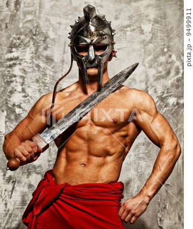 Gladiator with muscular body with sword and helmet Gladiator with muscular body with sword and helmet 9499911