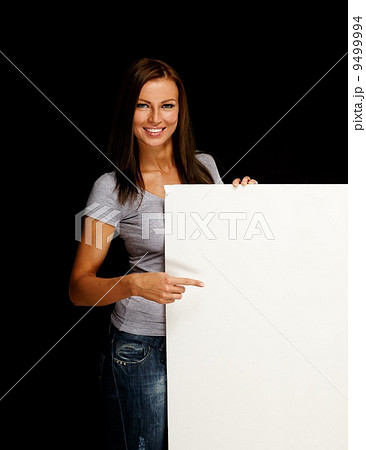 Beautiful young brunette woman with blank notice board Beautiful young brunette woman with blank notice board 9499994