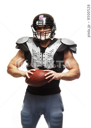 American football player with ball wearing helmet and protective shields 9500526