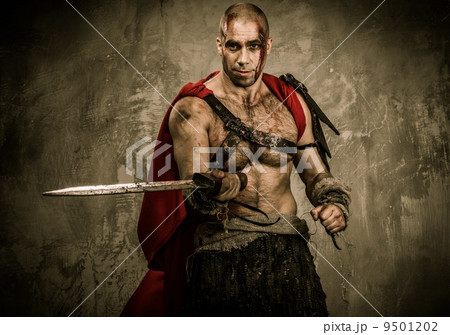 Wounded gladiator with sword covered in blood 9501202
