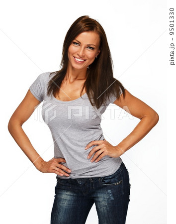 Young positive brunette girl with long hair wearing t-shirt and jeans 9501330