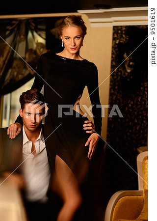 Sexy well-dressed young couple in luxury interior Sexy well-dressed young couple in luxury interior 9501619