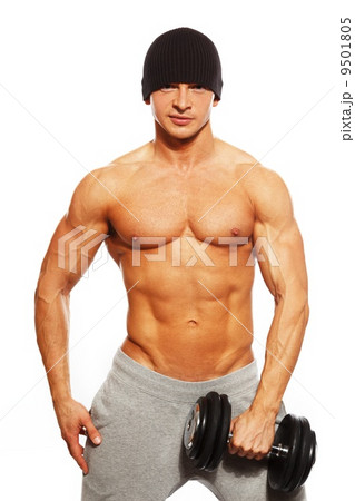Handsome young muscular man exercising with dumbbells 9501805
