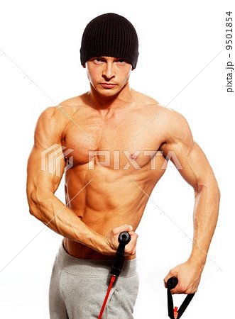 Handsome man with muscular body doing fitness exercise Handsome man with muscular body doing fitness exercise 9501854